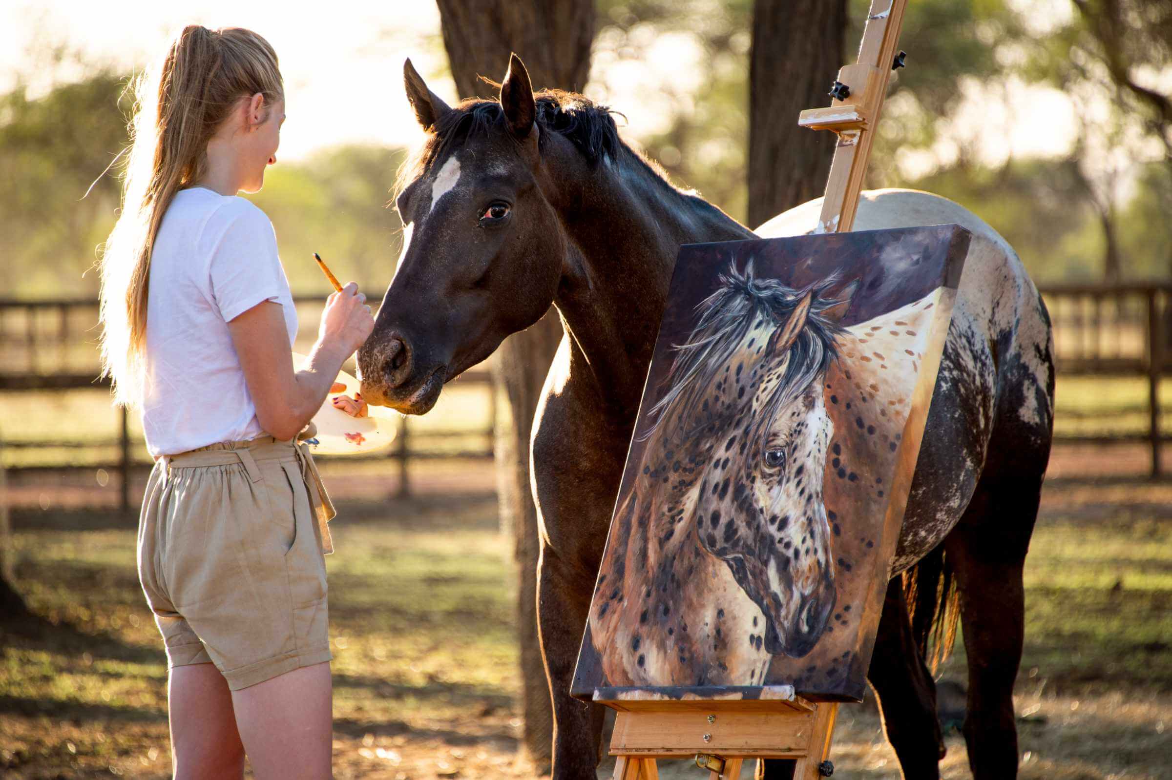An inquisitive horse comes to see what masterpiece this artist is painting whilst she paints in the Joseph's Dream Stud paddocks.